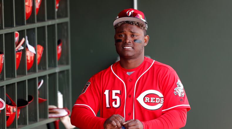 Cincinnati Reds’ Dilson Herrera walks in the dugout before a spring training baseball game against the Kansas City Royals, Wednesday, Feb. 28, 2018, in Surprise, Ariz. (AP Photo/Charlie Neibergall)