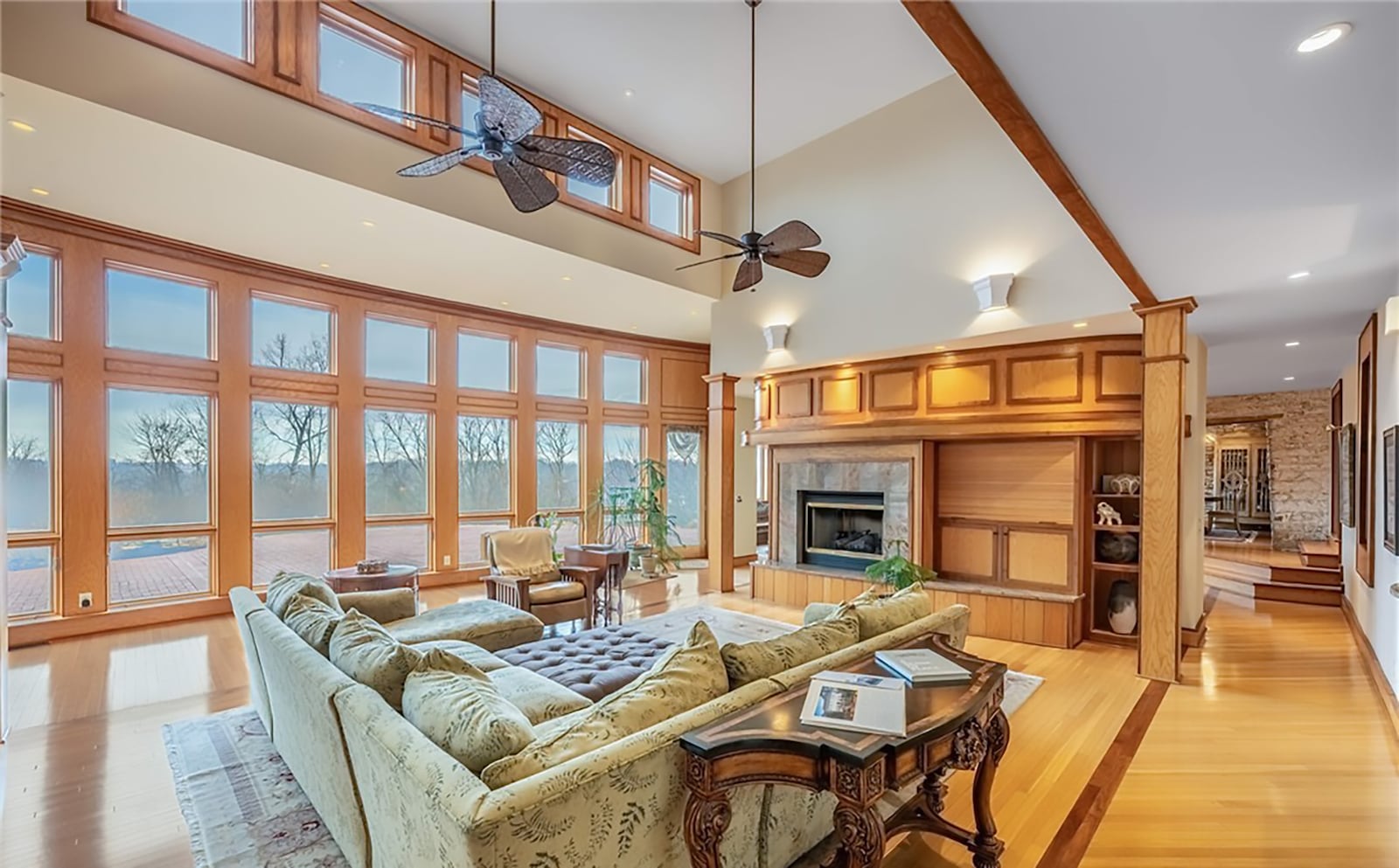 The two story great room is at the rear of the home and features a wall of windows overlooking the backyard. There are two ceiling fans and a built in entertainment center with a gas fireplace. CONTRIBUTED