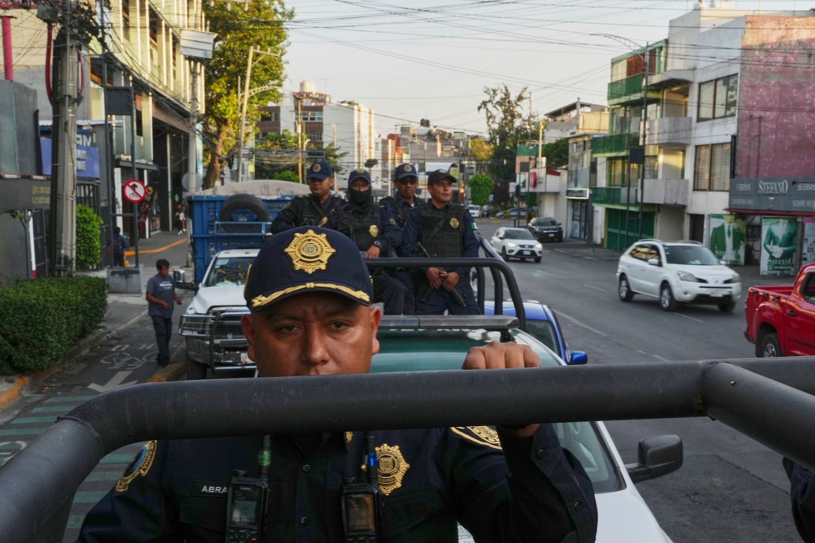 Mexico City police patrol a neighborhood in Mexico City, Wednesday, April 2, 2025. (AP Photo/Marco Ugarte)