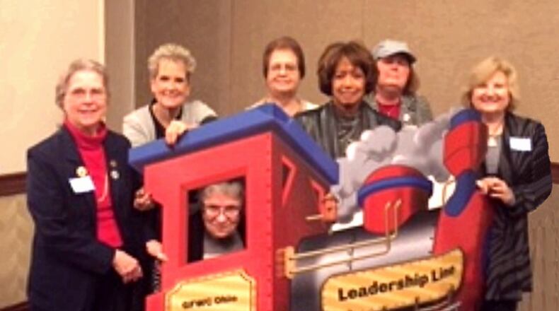 Representatives of the Springfield City Federation of Women Clubs attended the Ohio Federation of Women’s Clubs Northwest District meeting held March 22 in Lima. The club will celebrate its 125th anniversary next Friday and Saturday in Springfield. Photographed are L-R: Marianne L. Nave, Sandy Justice, Nadine Steele in the train window, Ellen Smith, Dianne Jordan, Christine Zechman and Louise Samosky. CONTRIBUTED