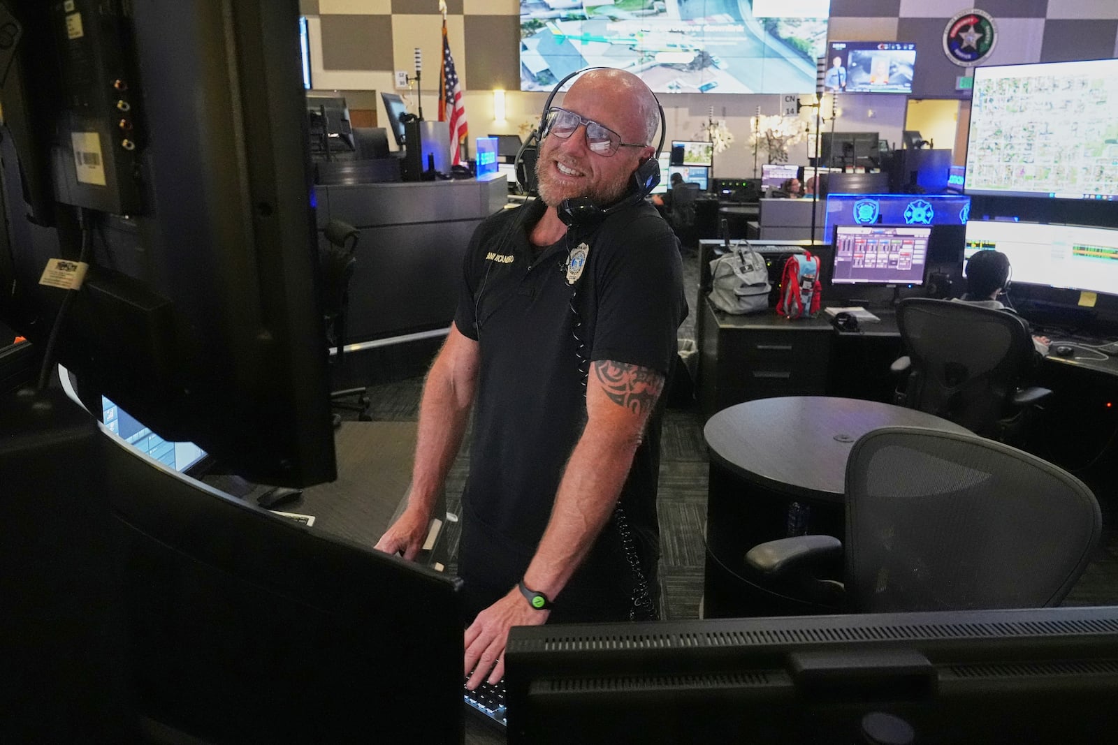 Senior dispatcher Jude Sannicandreo responds to an emergency call at the Collier County Emergency Services Center, Friday, July 11, 2025, in Naples, Fla. (AP Photo/Marta Lavandier)