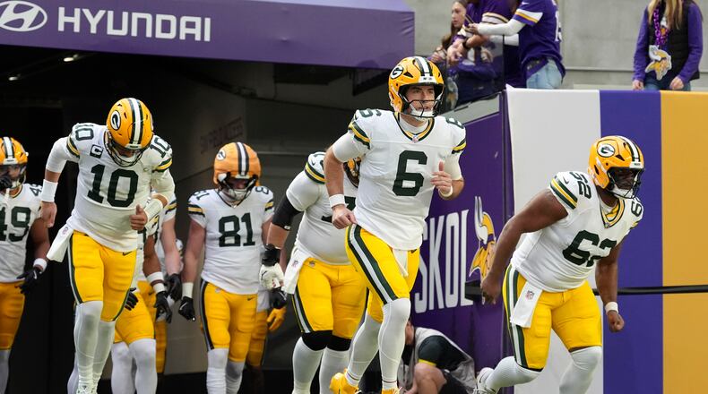 Green Bay Packers quarterback Clayton Tune (6) leads teammates onto the field before an NFL football game against the Minnesota Vikings, Sunday, Jan. 4, 2026, in Minneapolis. (AP Photo/Ross D. Franklin)