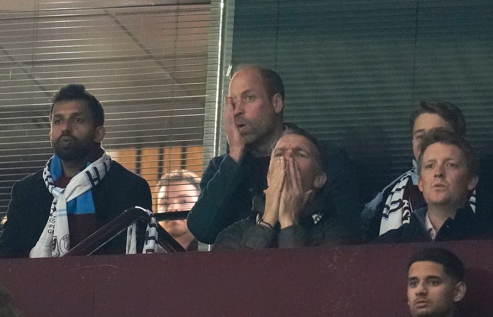 Britain's Prince William, centre top, reacts during the Champions League quarterfinal second leg soccer match between Aston Villa and Paris Saint-Germain at the Villa Park stadium, in Birmingham, England, Tuesday, April 15, 2025. (David Davies/PA via AP)