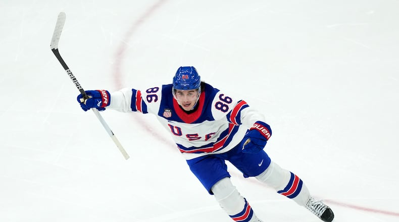 United States' Jack Hughes celebrates after scoring the winning goal against Canada during the overtime period of the men's ice hockey gold medal game at the 2026 Winter Olympics in Milan, Italy, Sunday, Feb. 22, 2026. (AP Photo/Carolyn Kaster)