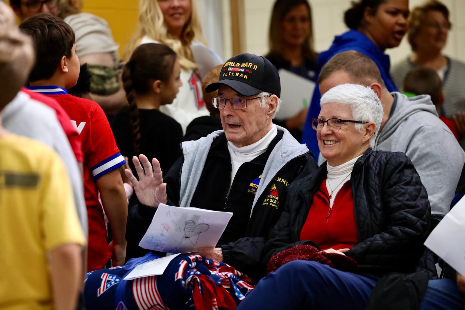 Kenwood Elementary School students greet veterans and other special guests prior to a Veterans Day ceremony held Nov. 11, 2025 that featured performances from the Springfield High School Marching Wildcat Band, Drill Team and MJROC Color Guard. CONTRIBUTED