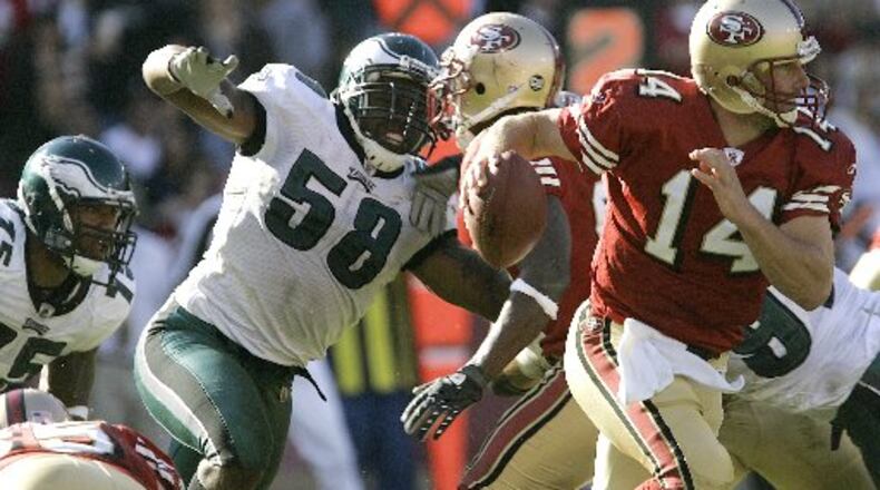 Philadelphia Eagles' Trent Cole (58) rushes San Francisco 49ers quarterback J.T. O'Sullivan (14) in the fourth quarter of an NFL football game, Sunday, Oct. 12, 2008, in San Francisco. (AP Photo/Ben Margot)