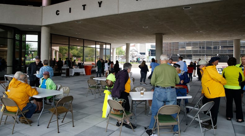 The weather didn't cooperate, but several die-hard cyclists made the ride in the rain for the Bike to Work Day Springfield event. The city combined the Bike to Work Day event with the unveiling of the renovated City Hall Plaza that's mostly finished after being closed for more than a year. BILL LACKEY/STAFF