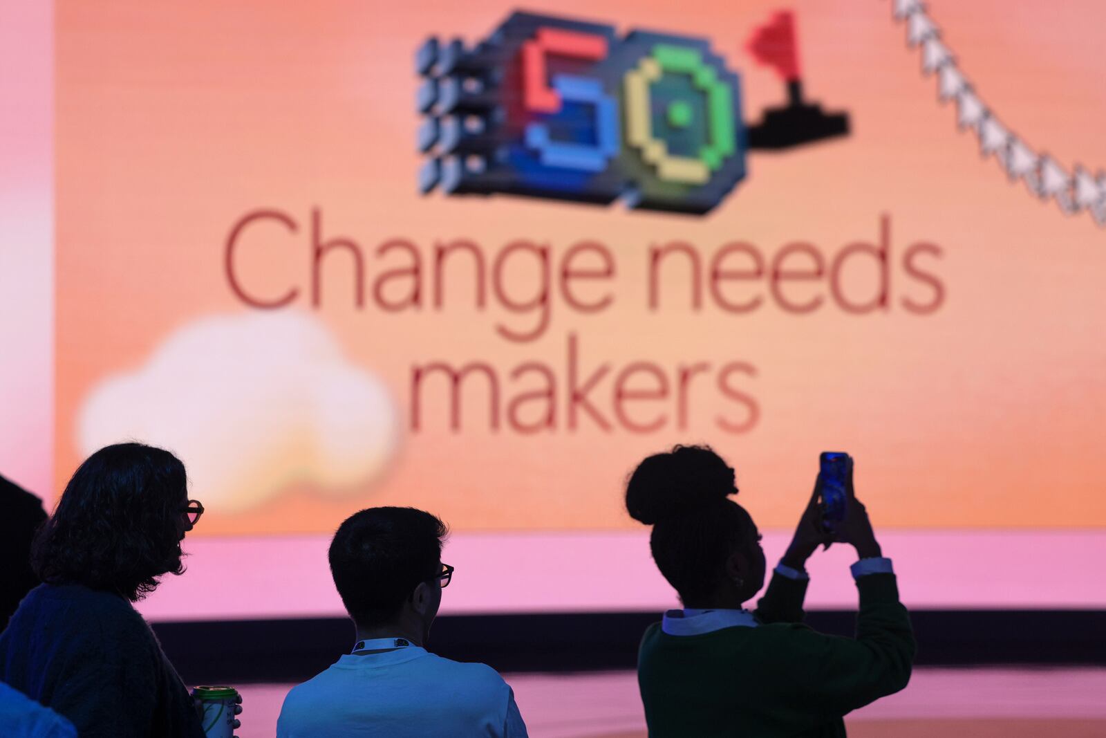 Attendees are pictured before a presentation of Microsoft's AI assistant, Copilot, and celebration of the company's 50th anniversary at Microsoft headquarters, Friday, April 4, 2025, in Redmond, Wash. (AP Photo/Jason Redmond)