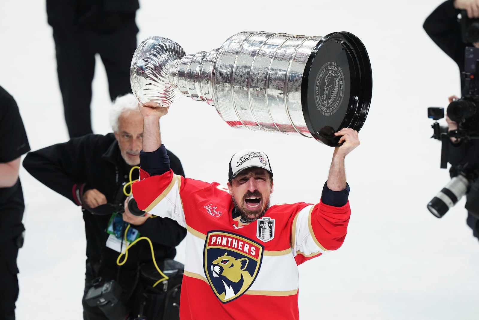 Florida Panthers' Brad Marchand (63) raises the Stanely Cup after defeating the Edmonton Oilers in Game 6 of the NHL hockey Stanley Cup Final in Sunrise, Fla., Tuesday, June 17, 2025. (Nathan Denette/The Canadian Press via AP)