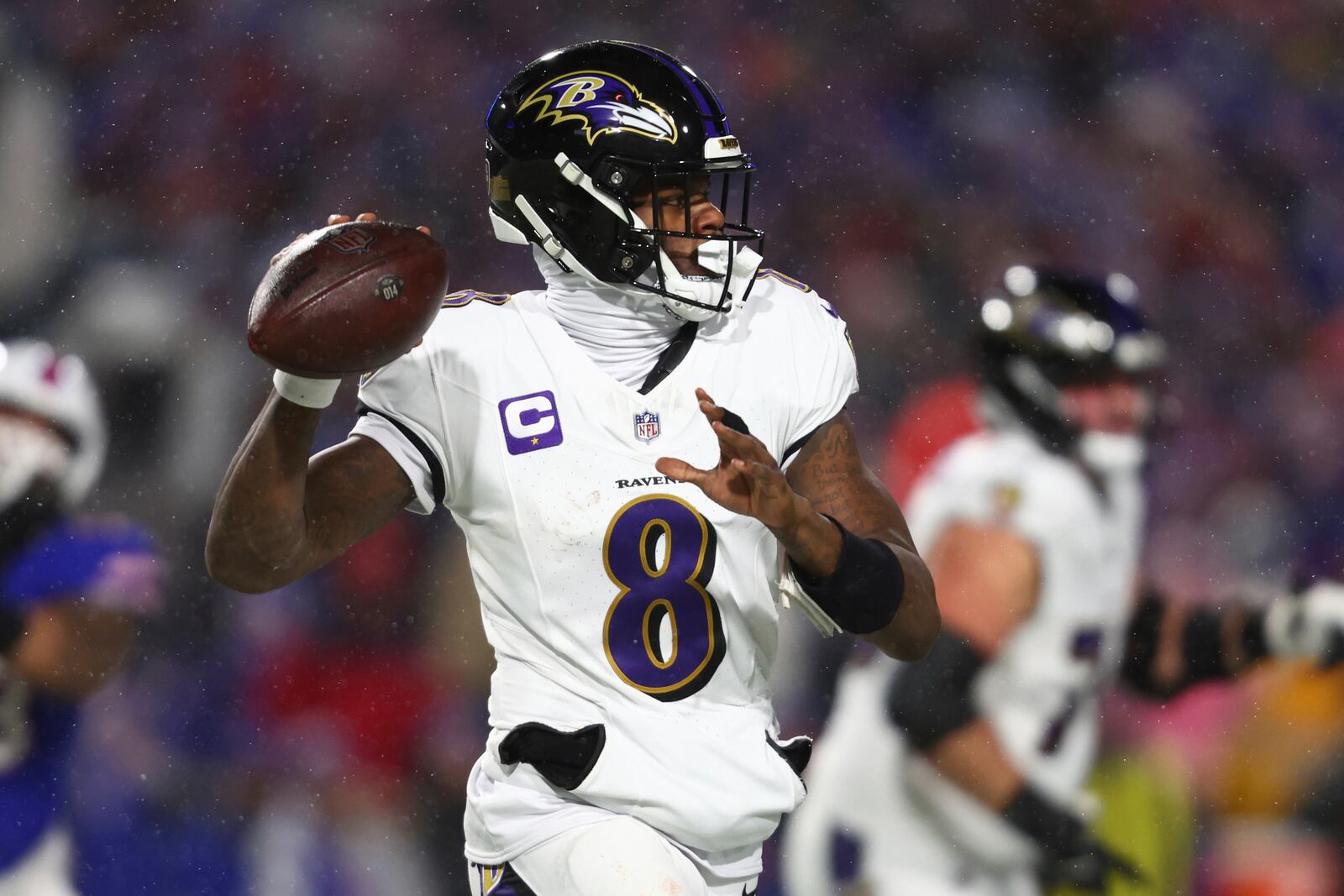 FILE - Baltimore Ravens quarterback Lamar Jackson (8) looks to pass the ball during the first half of an NFL football divisional playoff game against the Buffalo Bills in Orchard Park, N.Y., Jan. 19, 2025. (AP Photo/ Jeffrey T. Barnes, File)