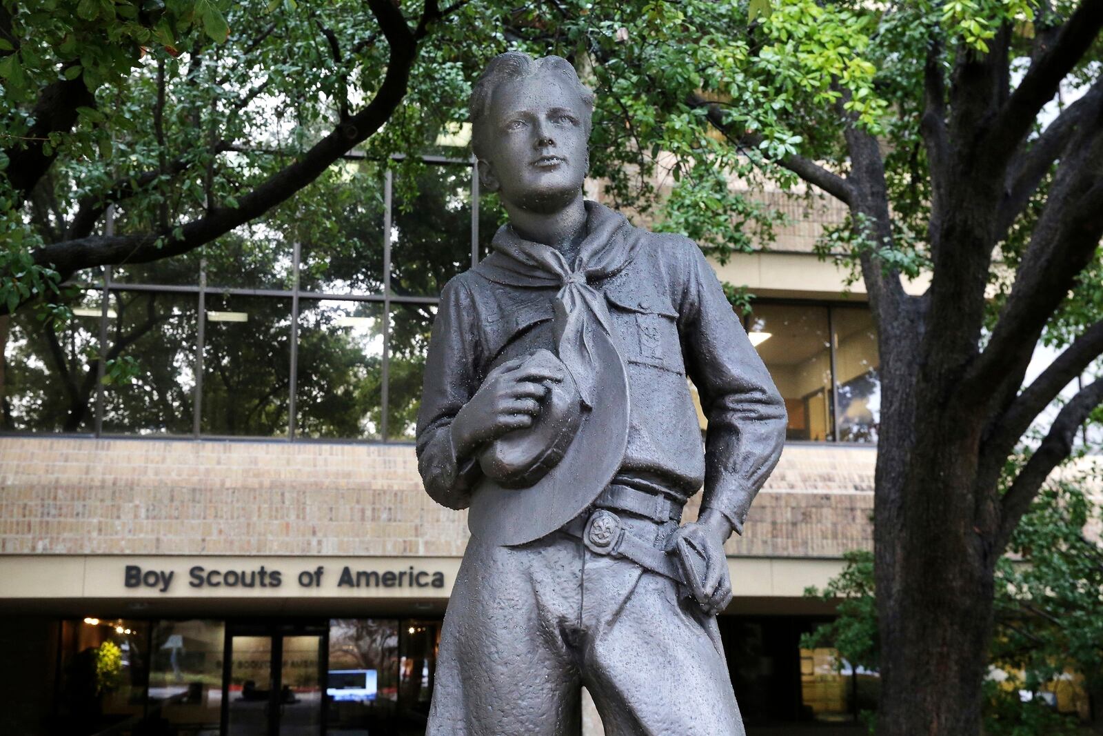 FILE - A statue stands outside the Boy Scouts of America headquarters in Irving, Texas, Feb. 12, 2020. (AP Photo/LM Otero, File)