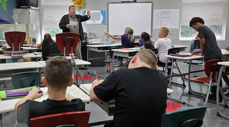 Students at Kenwood Elementary School, within the Springfield City School District, work in class. BILL LACKEY/STAFF
