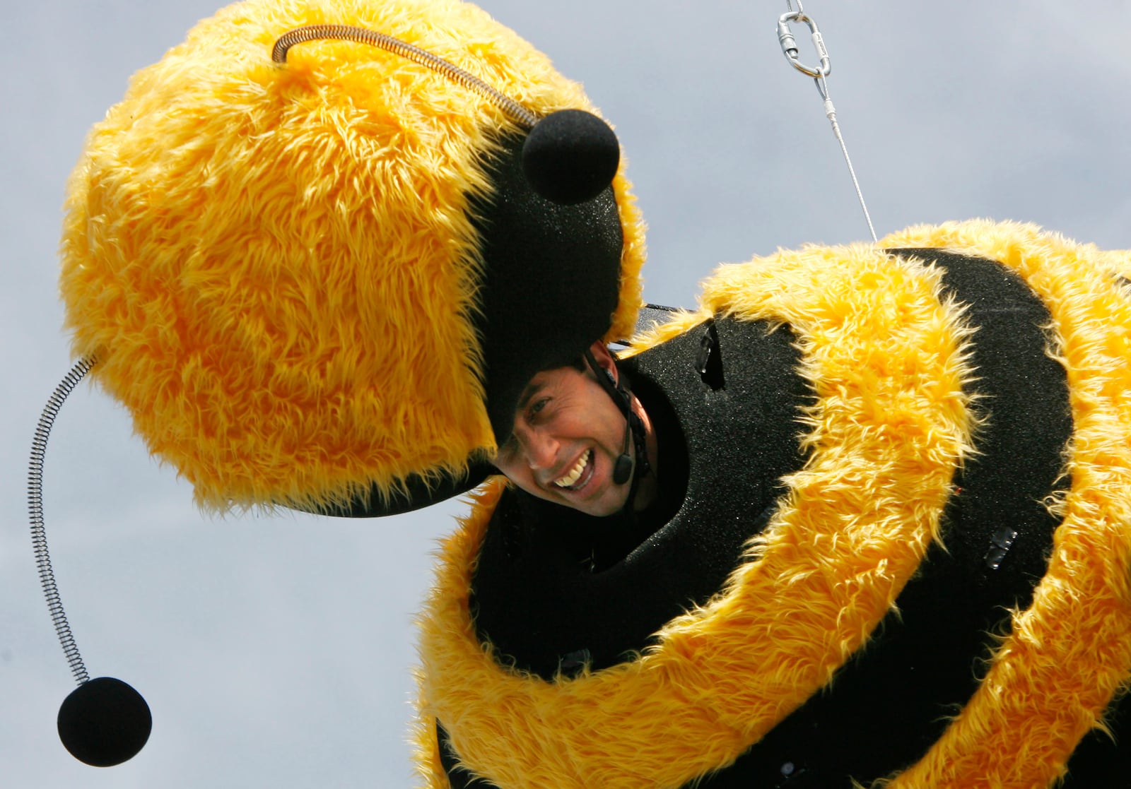 FILE - American comedian Jerry Seinfeld glides through the air connected to a wire during a publicity stunt for the film "Bee Movie," at the 60th International film festival in Cannes, southern France, on Thursday, May 17, 2007. (AP Photo/Andrew Medichini, File)