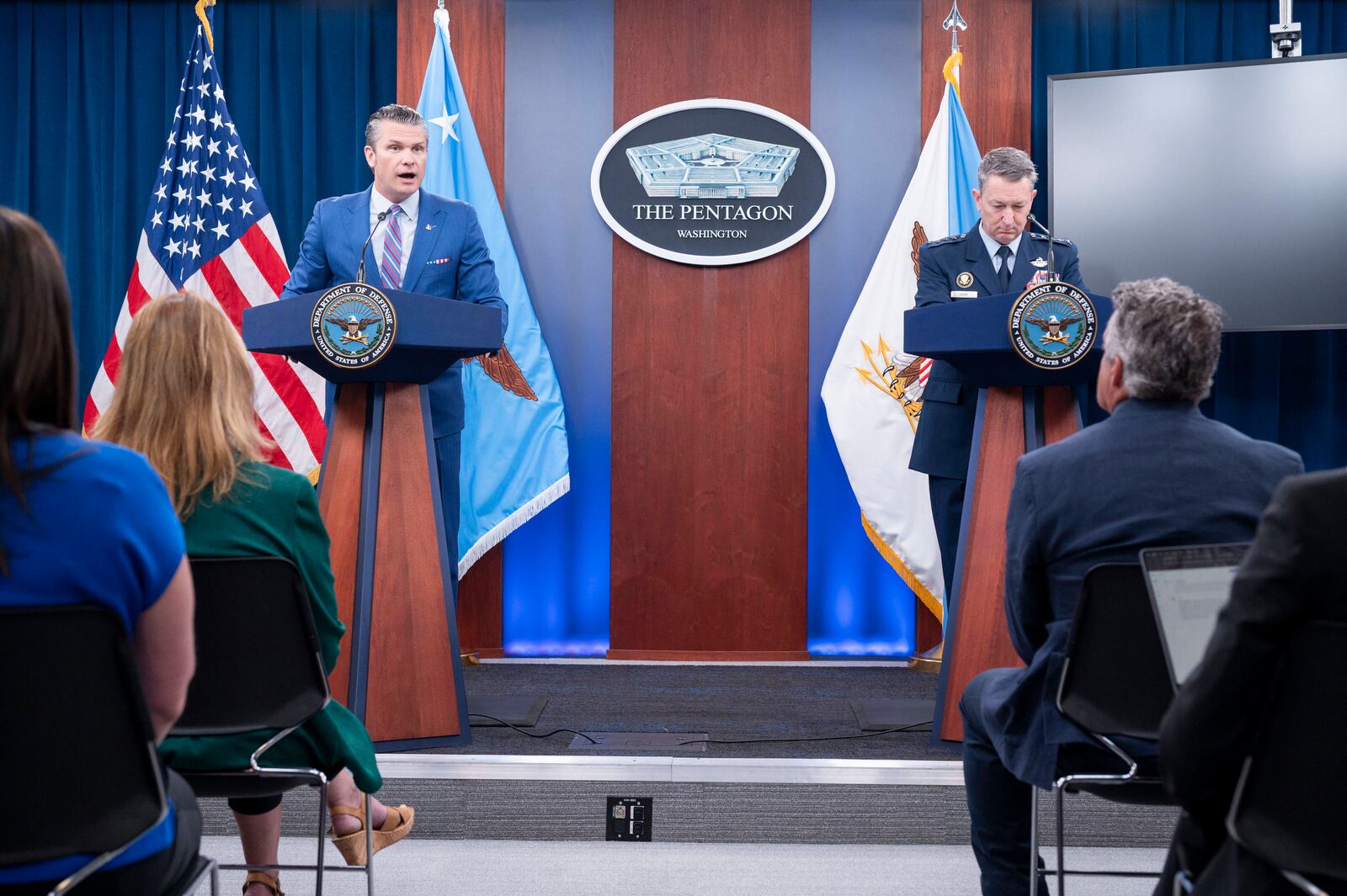 Defense Secretary Pete Hegseth and Joint Chiefs Chairman Gen. Dan Caine, right, take part in a news conference at the Pentagon, Thursday, June 26, 2025 in Washington. (AP Photo/Kevin Wolf)