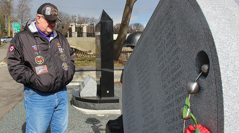 Vietnam veteran Randy Ark looks at a monument honoring all Clark County residents who died in the Vietnam war. JEFF GUERINI/STAFF