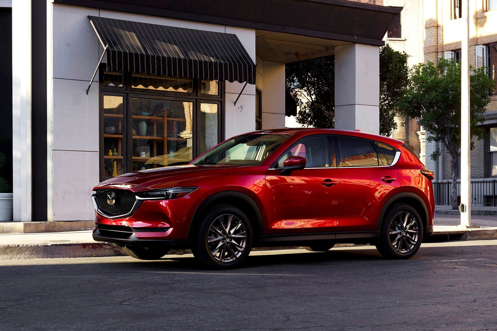 This photo provided by Mazda shows the 2020 CX-5 small SUV. The CX-5 is sporty but also scores well on more sensible fronts like crash testing. (Courtesy of Mazda North American Operations via AP)