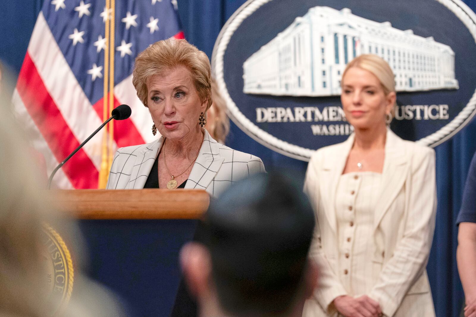 Education Secretary Linda McMahon accompanied by Attorney General Pam Bondi, right, speaks during a news conference at the Department of Justice headquarters in Washington, Wednesday, April 16, 2025. (AP Photo/Jose Luis Magana)