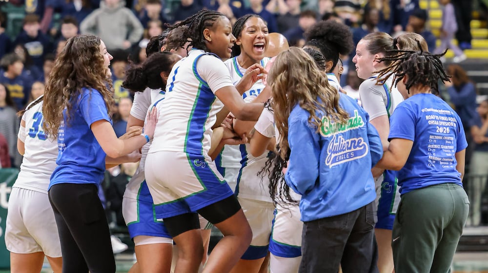 Chaminade-Julienne players celebrate after defeating Copley 62-57 in a Division III state semifinal on Thursday, March 12 at Ervin J. Nutter Center in Fairborn. BRYANT BILLING / STAFF
