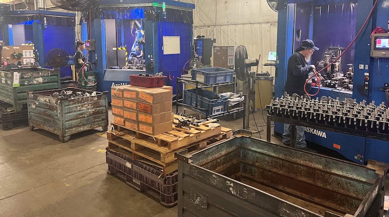 Workers at McGregor Metal's Leffel Lane facility work on Wednesday. The company plans to add a 21,000 square-foot addition to accommodate the need for more equipment and space as the company is seeing an increase in sales. Hasan Karim/Staff