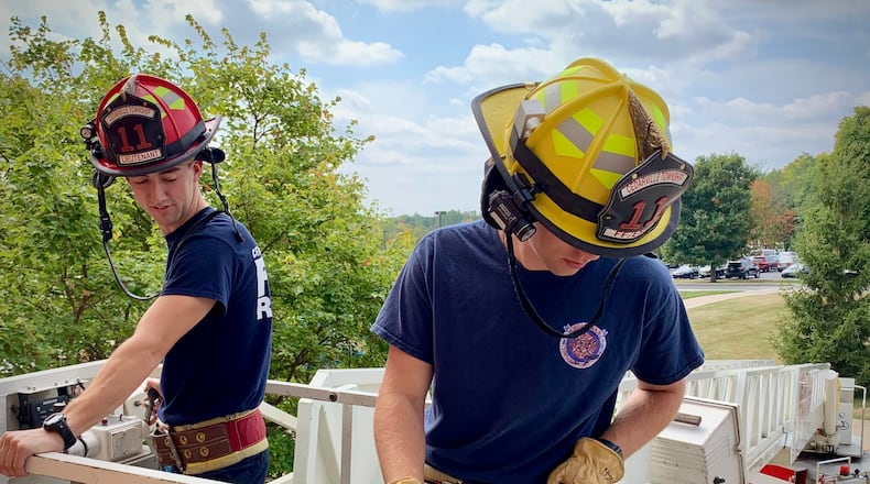 Lieutenant Luke Neikirk and firefighter Ben Supplee practice operating fire equipment at Cedarville University, Tuesday, Sept. 26, 2023. LONDON BISHOP/STAFF
