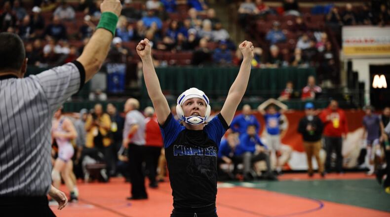 Miami East’s Olivia Shore has her hand raised after winning her opening-round bout at the state wrestling tournament Thursday at the Schottenstein Center in Columbus. Greg Billing/CONTRIBUTED