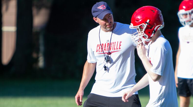 New Cedarville High School football coach Brian Bogenschutz talks to a player during a practice last week. Jeff Gilbert/CONTRIBUTED