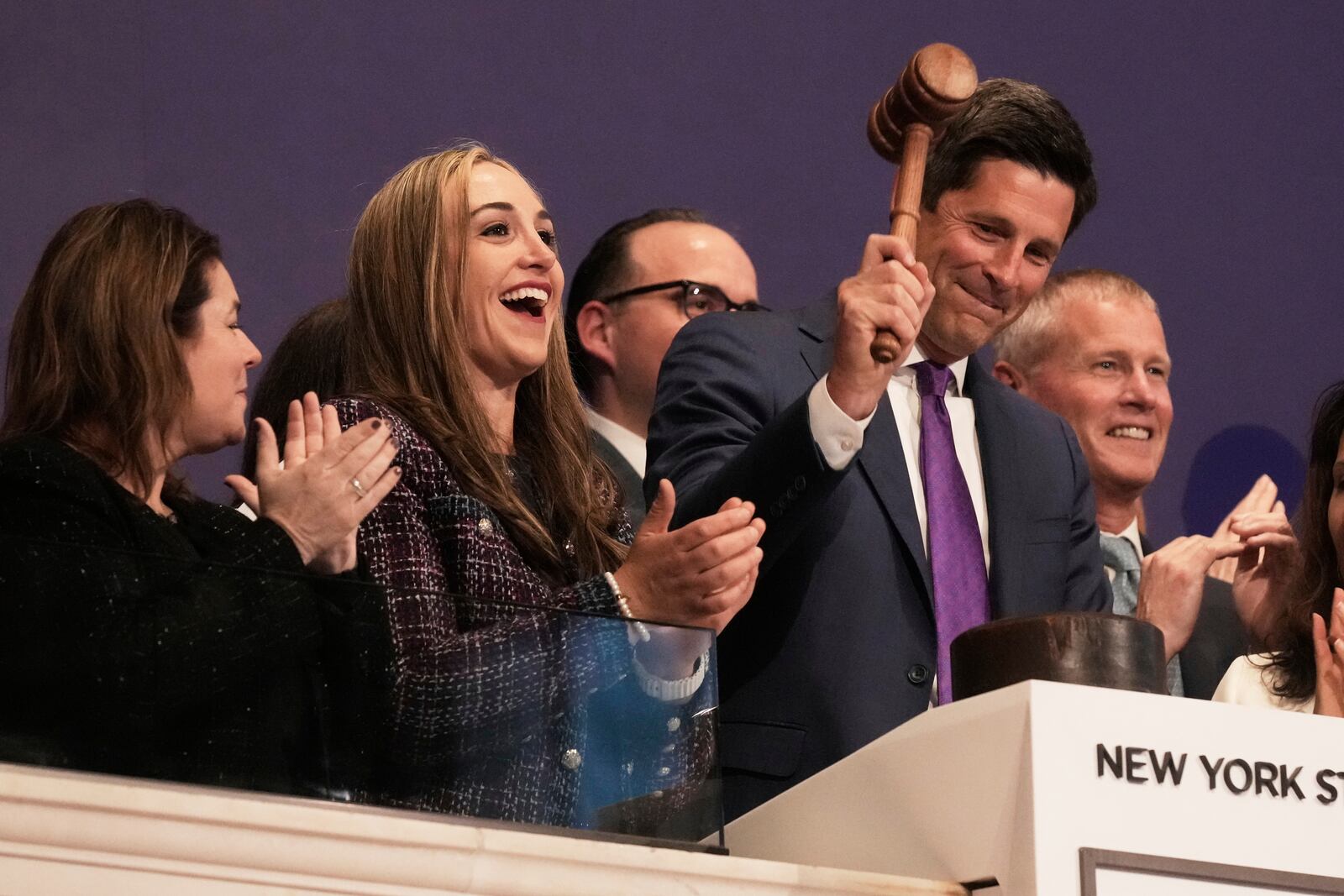 Charles Schwab President & CEO Rick Wurster gavels trading closed at the New York Stock Exchange, Thursday, May 1, 2025. (AP Photo/Richard Drew)