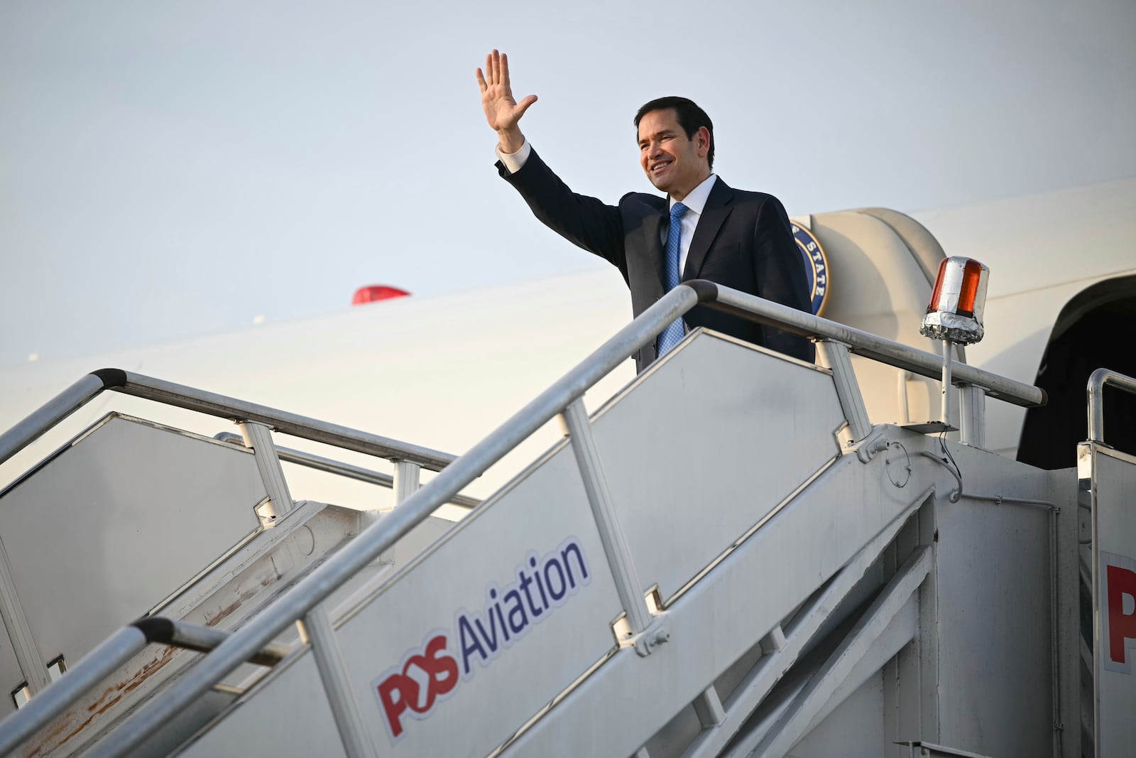 US Secretary of State Marco Rubio gestures as he boards his flight before departing from Subang Air Base, on the outskirts of Kuala Lumpur, on Friday, July 11, 2025, after attending the 58th ASEAN Foreign Ministers' meeting. (Mandel Ngan/Pool Photo via AP)