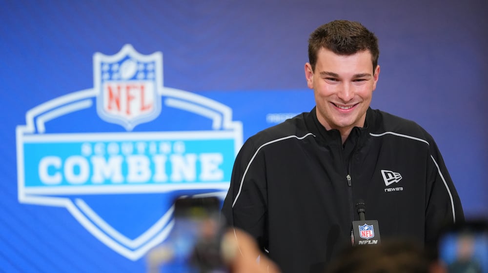 FILE - Indiana quarterback Fernando Mendoza (11) speaks during a news conference at the NFL football scouting combine in Indianapolis, Feb. 27, 2026. (AP Photo/Julio Cortez, File)