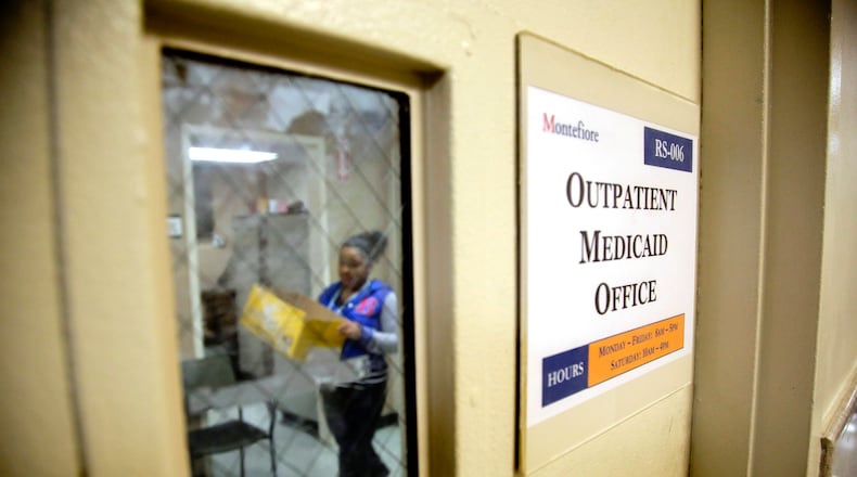 FILE - A Medicaid office employee works on reports at Montefiore Medical Center, Nov. 21, 2014, in New York. (AP Photo/Julie Jacobson, File)