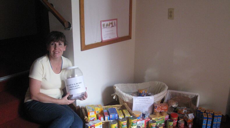 Jill Weubker accepting food and donations for the Backpack Buddies program. CONTRIBUTED