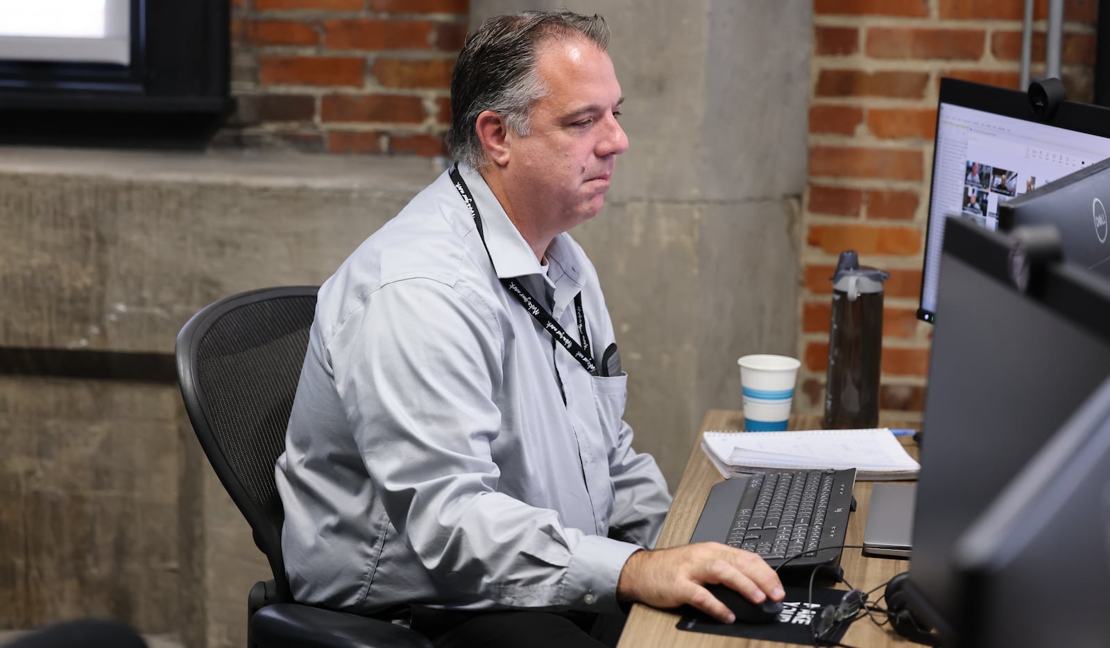 Dayton Daily News reporter Michael Kurtz works a desk in the paper's office in downtown Dayton on Thursday, Sept. 11. BRYANT BILLING / STAFF