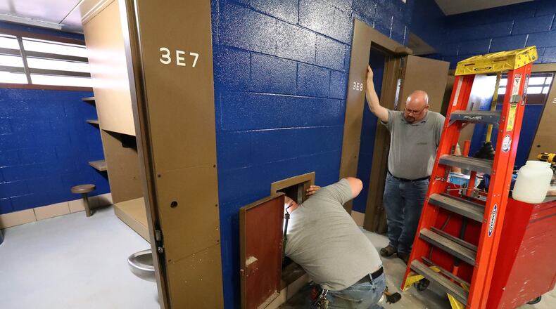 Maintenance workers at the Clark County Jail work on the plumbing in one of the cell blocks getting rehabed Thursday, June 14, 2018. BILL LACKEY/STAFF
