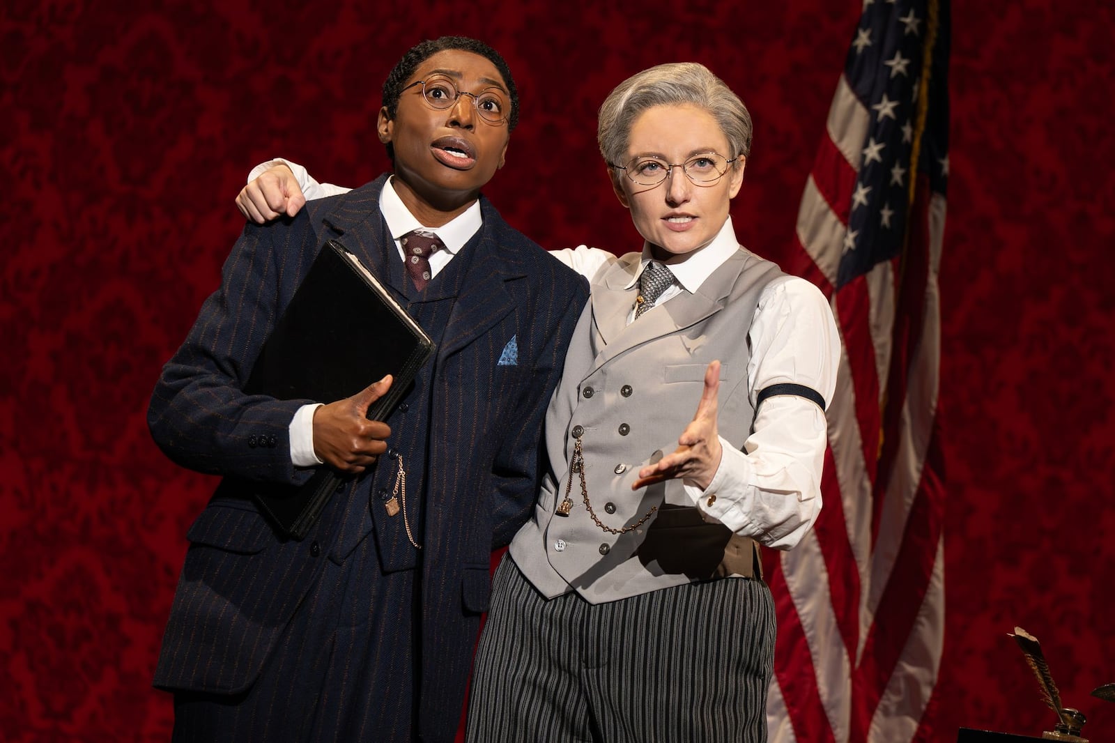 Brandi Porter as Dudley Malone and Jenny Ashman as President Woodrow Wilson in "Suffs," which will be on state at The Schuster in Dayton. CONTRIBUTED