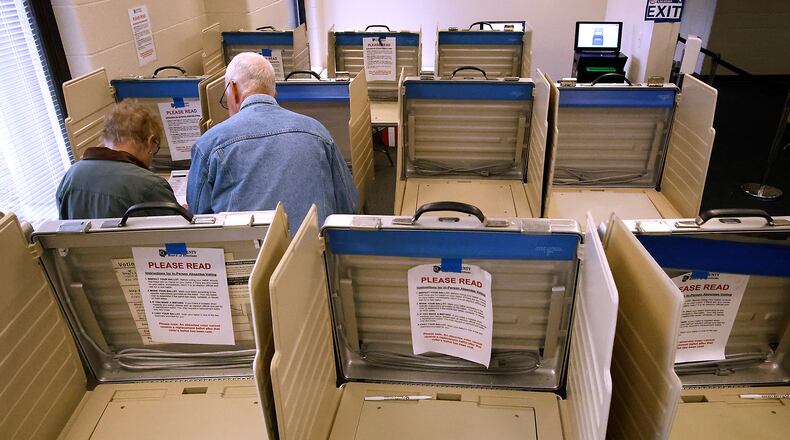 A couple casts their votes at the Clark County Board of Elections Tuesday, Oct. 17, 2023. BILL LACKEY/STAFF