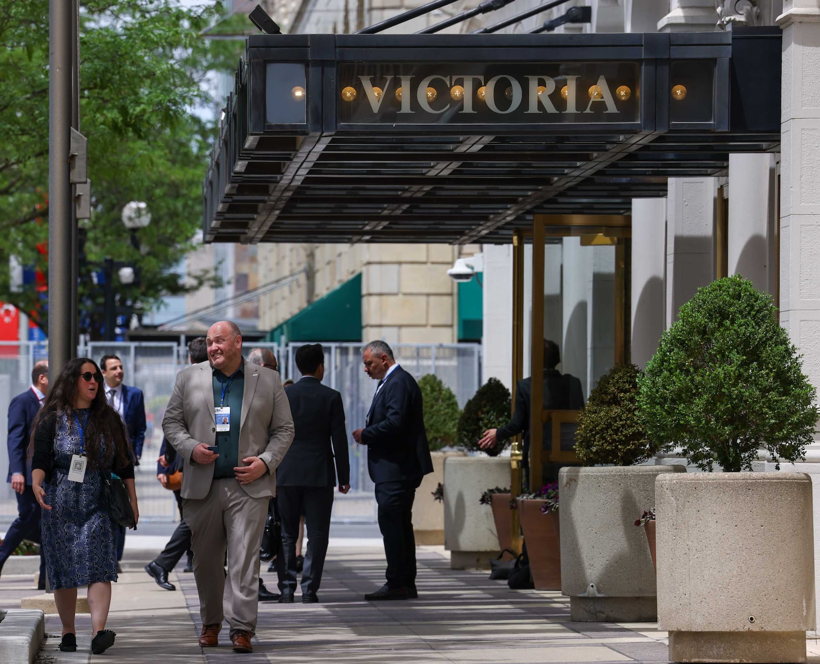 Officials walk near the Victoria Theatre inside the NATO Parliamentary Assembly security zone on Saturday, May 24, 2025. BRYANT BILLING / STAFF