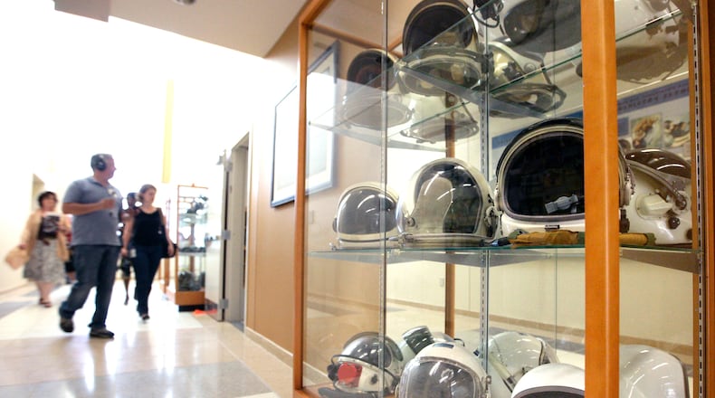 A history of Air Force space flight helmets is on display in the Air Force Research Lab’s 711th Human Performance Wing at Wright-Patterson Air Force Base, seen in this July 2019 photo. Butt Construction built the wing headquarters. TY GREENLEES / STAFF
