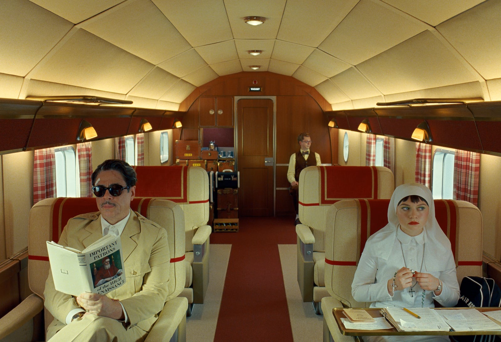 This image released by Focus Features shows, from left, Benicio Del Toro, Michael Cera and Mia Threapleton in a scene from "The Phoenician Scheme." (TPS Productions/Focus Features via AP)