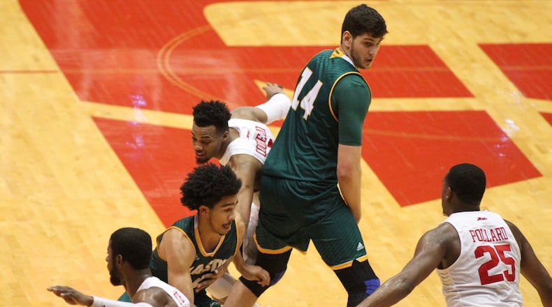 George Mason’s Otis Livingston II drives to the basket against Dayton on Tuesday, Feb. 21, 2017, at UD Arena. David Jablonski/Staff