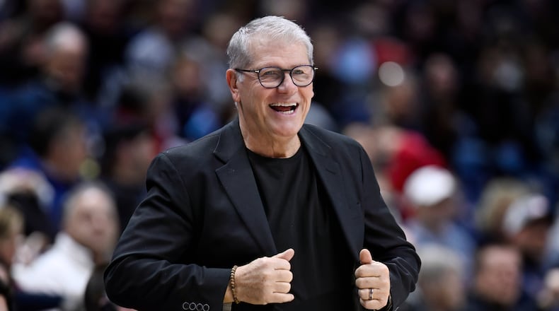 UConn head coach Geno Auriemma smiles in the first half of an NCAA college basketball game against Creighton, Wednesday, Feb. 11, 2026, in Storrs, Conn. (AP Photo/Jessica Hill)