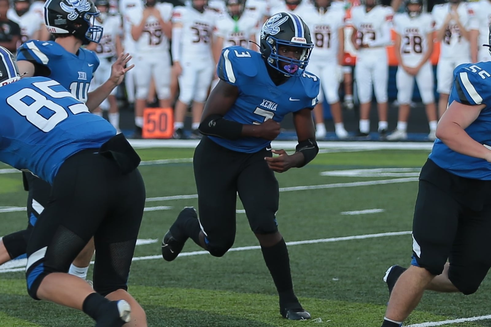 Xenia running back Deaunte White runs through a hole provided by the offensive line during a game Friday, Aug. 22, 2025, at Doug Adams Stadium in Xenia. Steve Black / Staff
