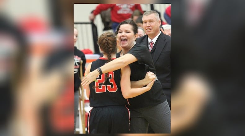 Tecumseh coach Danielle Thomas hugs senior Danielle Franklin after Tecumseh’s 57-48 win at Tippecanoe in January, 2016. FILE