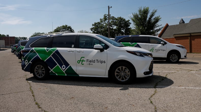 Field Trips By Via vehicles sit in a parking lot of Clark County Public Library on Tuesday, July 8, 2025. JOSEPH COOKE/STAFF