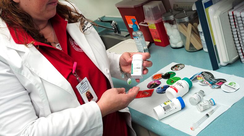 Kitty Smith, from the Clark County Combined Health District, talks about some of the medication used to treat STD’s in July 2020. Bill Lackey/Staff file