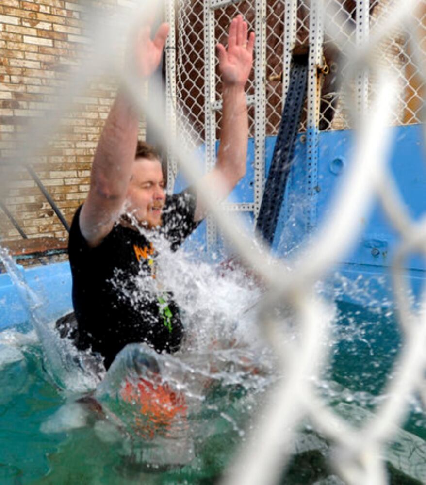 Sun columnist Andy McGinn sits in a dunking tank for charity