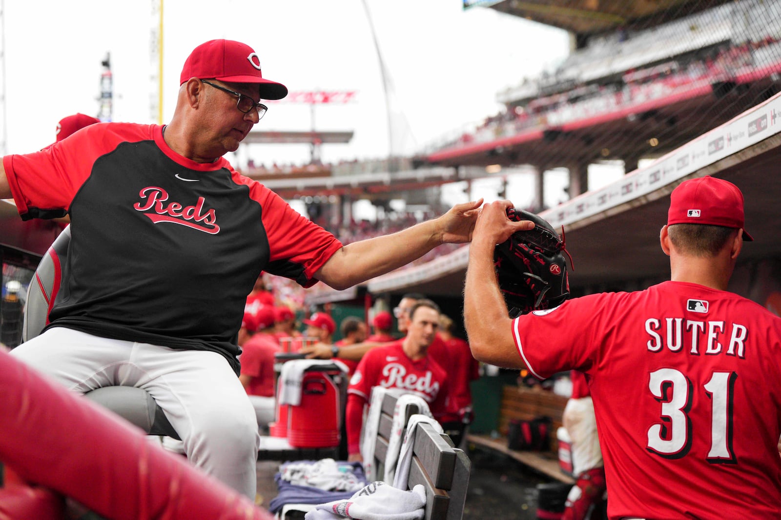 Cincinnati Reds' Brent Suter (31) celebrates with manager Terry Francona during the eighth inning of a baseball game against the San Diego Padres, Saturday, June 28, 2025, in Cincinnati. (AP Photo/Jeff Dean)