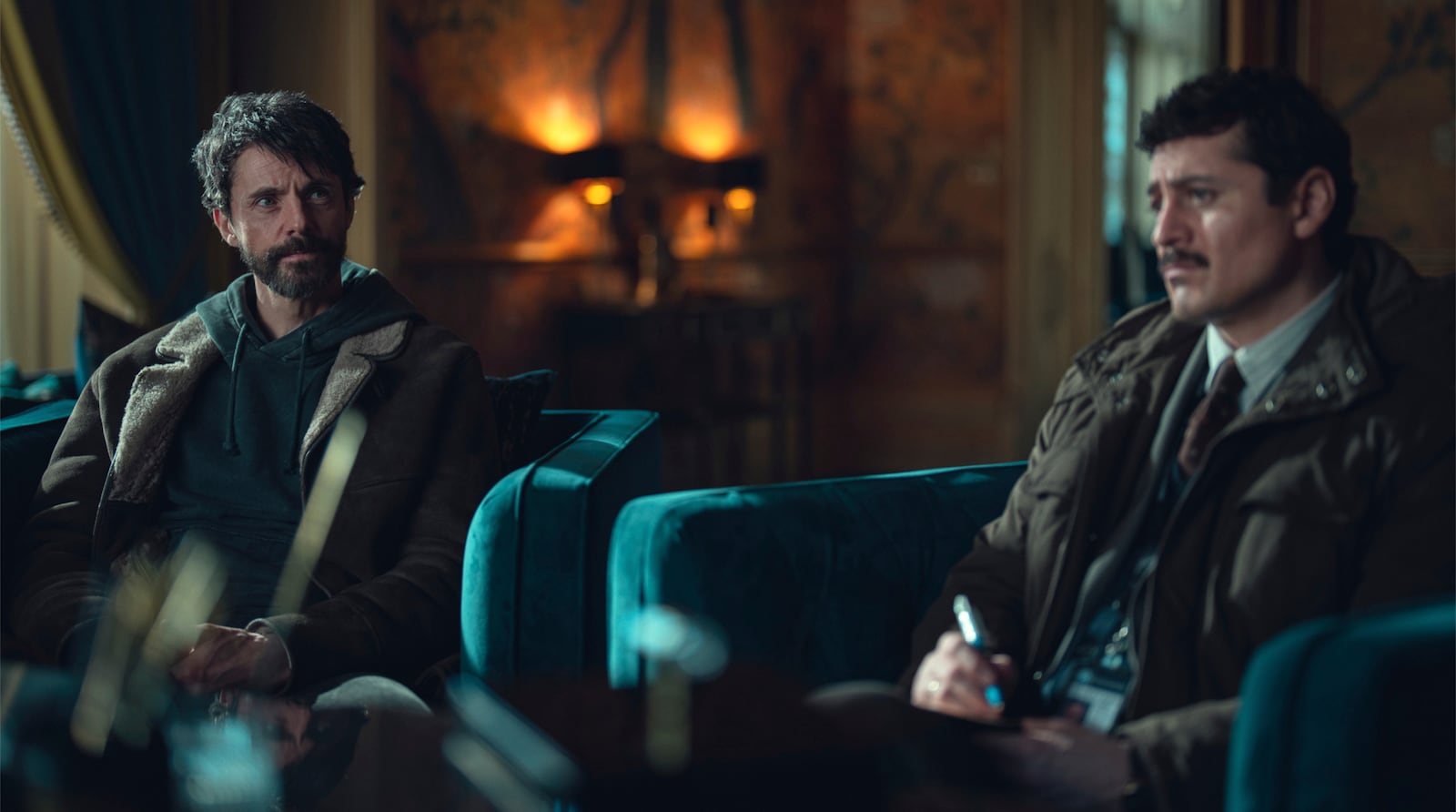 This image released by Netflix shows Matthew Goode, left, and Alexej Manvelov in a scene from the series "Dept. Q." (Netflix via AP)