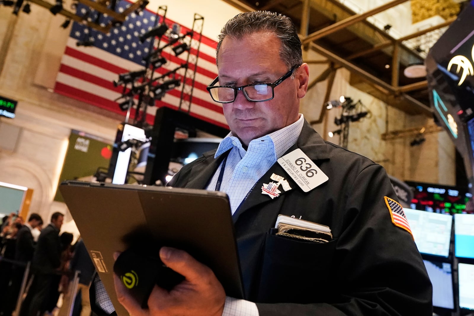 Trader Edward Curran works on the floor of the New York Stock Exchange, Tuesday, May 20, 2025. (AP Photo/Richard Drew)
