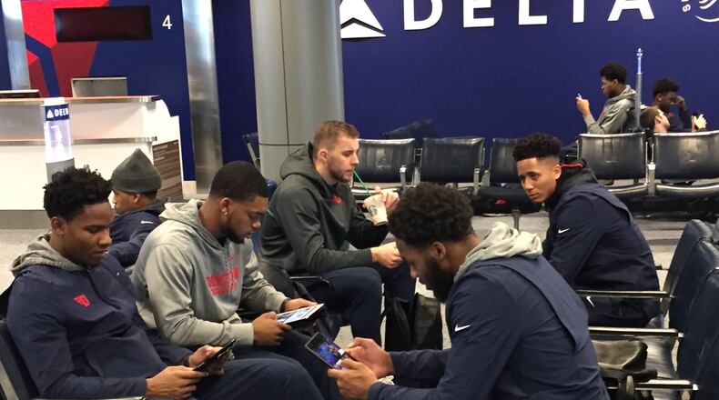 Dayton Flyers players wait for their flight to California on Sunday morning at Cincinnati/Northern Kentucky International Airport. Larry Hansgen / STAFF