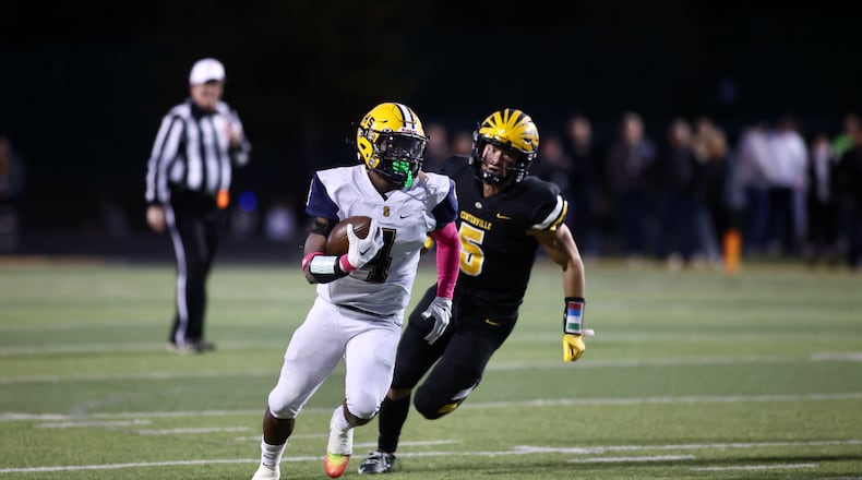Springfield's Javin Norman runs for a touchdown against Centerville on Friday, Oct. 7, 2022, at Centerville Stadium. David Jablonski/Staff